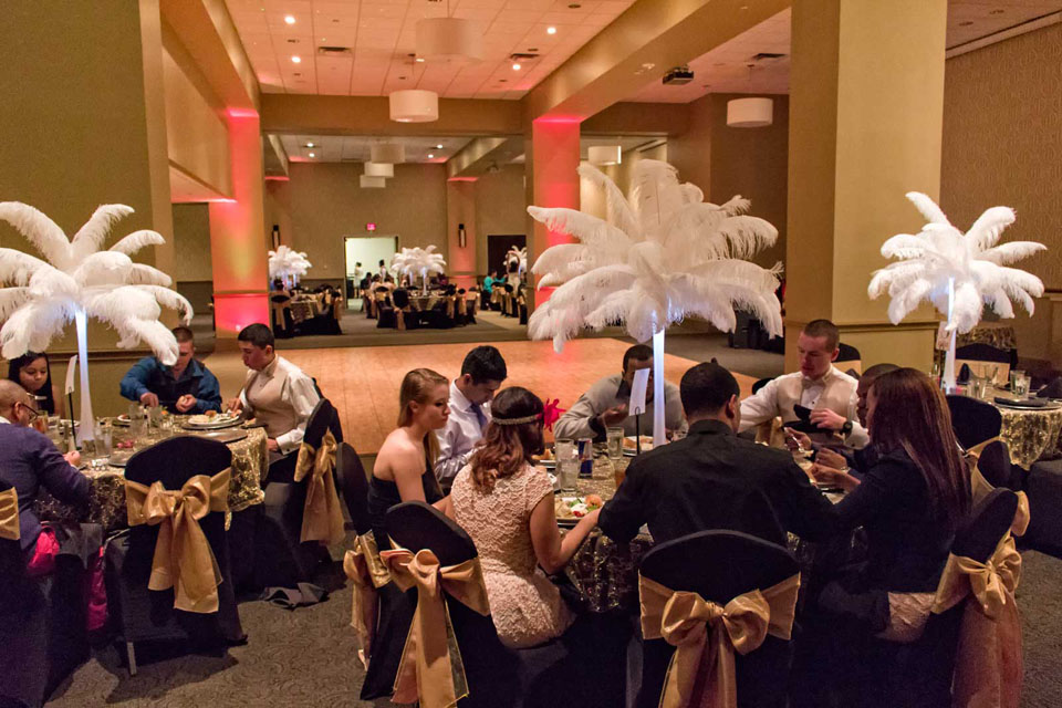Fabulous Feather Palm centerpieces, gold and black theme at a Special Celebration at the Red Oak Ballroom in Fort Worth, Sundance Square