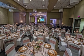 Ornately decorated Wedding at the Red Oak Ballroom in Fort Worth, Sundance Square. Specialty table overlays, chair covers with ties, plate chargers, and custom centerpieces Ornately decorated Wedding at the Red Oak Ballroom in Fort Worth, Sundance Square