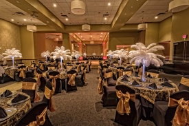 Fabulous Specialty Table Decorations of Feather Palms, gold and black theme at a Special Celebration at the Red Oak Ballroom in Fort Worth, Sundance Square Fabulous Feather Palm centerpieces, gold and black theme at a Special Celebration at the Red Oak Ballroom in Fort Worth, Sundance Square