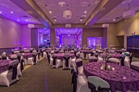Stately Purple Wedding at the Red Oak Ballroom in Fort Worth, Sundance Square. Specialty table overlays, chair covers with ties, and custom centerpieces Stately Purple Wedding at the Red Oak Ballroom in Fort Worth, Sundance Square