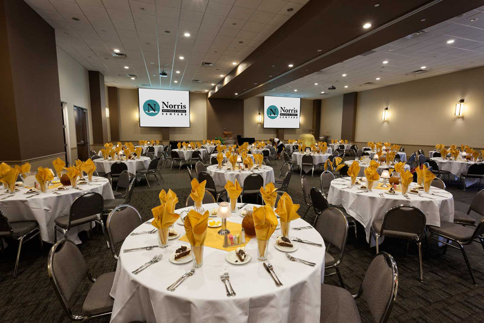 Wide View of Luncheon Setup in Gold and White with preset Dessert, at the Norris Centers in Austin