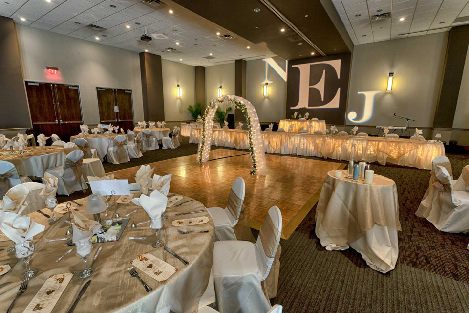 Elegant Gold and White Room setup with Decorated Arch, Wedding at the Red Oak Ballroom in Austin