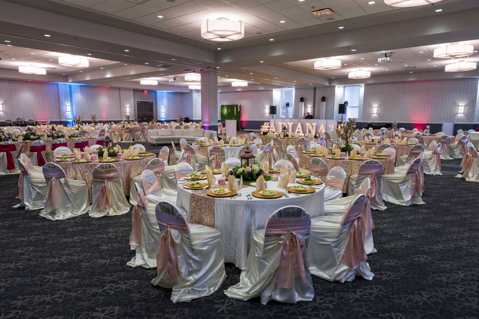 Fabulous Quinceanera at the Red Oak Ballroom in San Antonio featuring Upgraded Table Linens with Runners, Chair Covers with Ties and Plate Chargers with Preset Salads